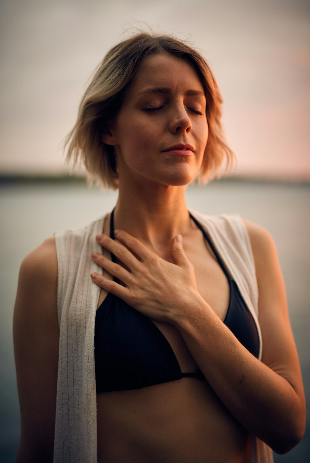 person meditating at sunrise