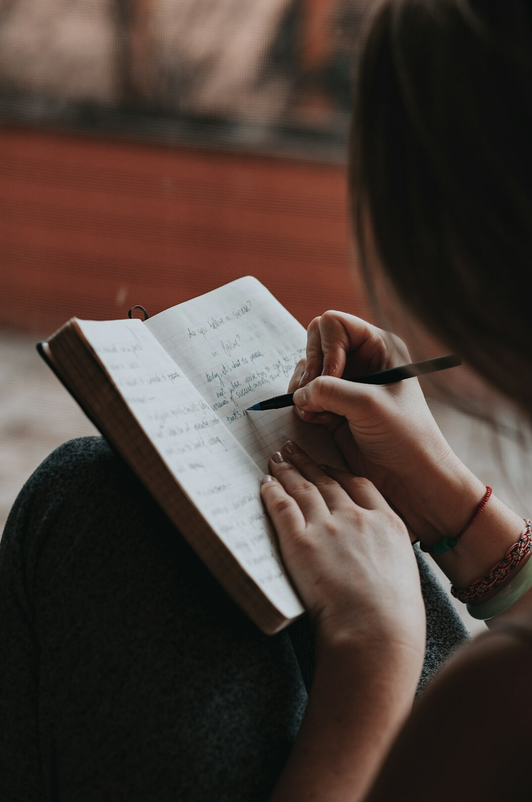 person journaling daily habits