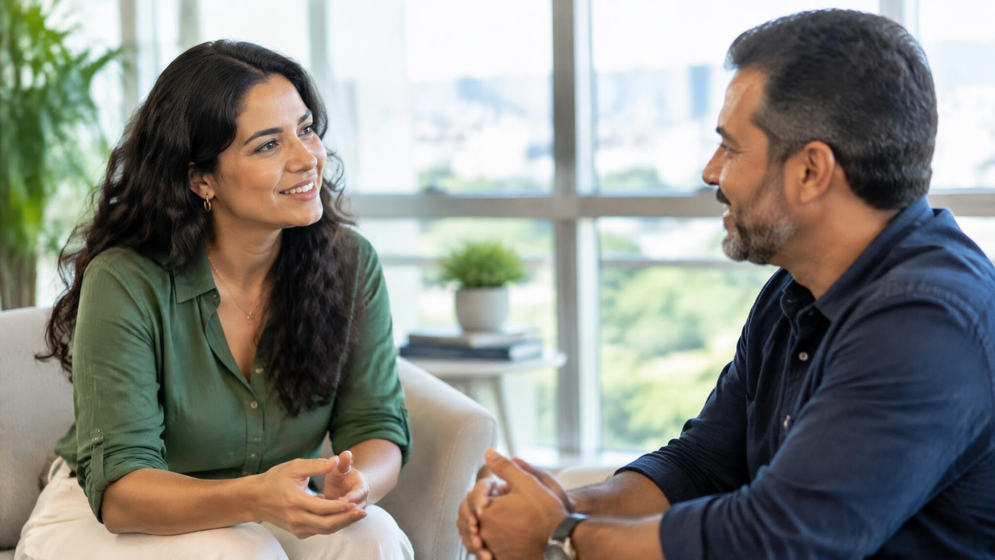 Two people having a warm conversation in a bright modern room